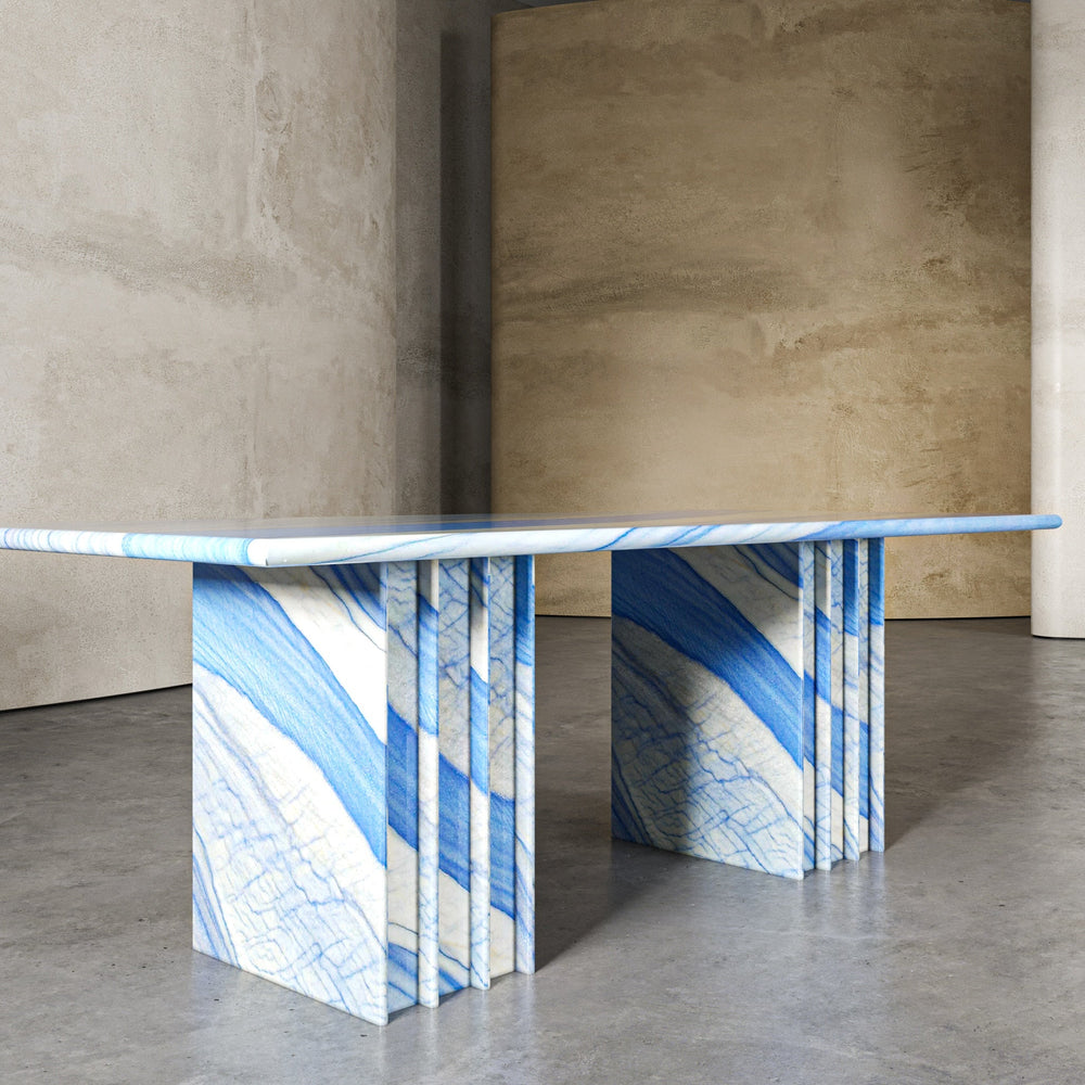 A marble dining table set for a meal