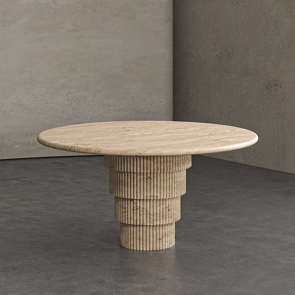 A round travertine dining table