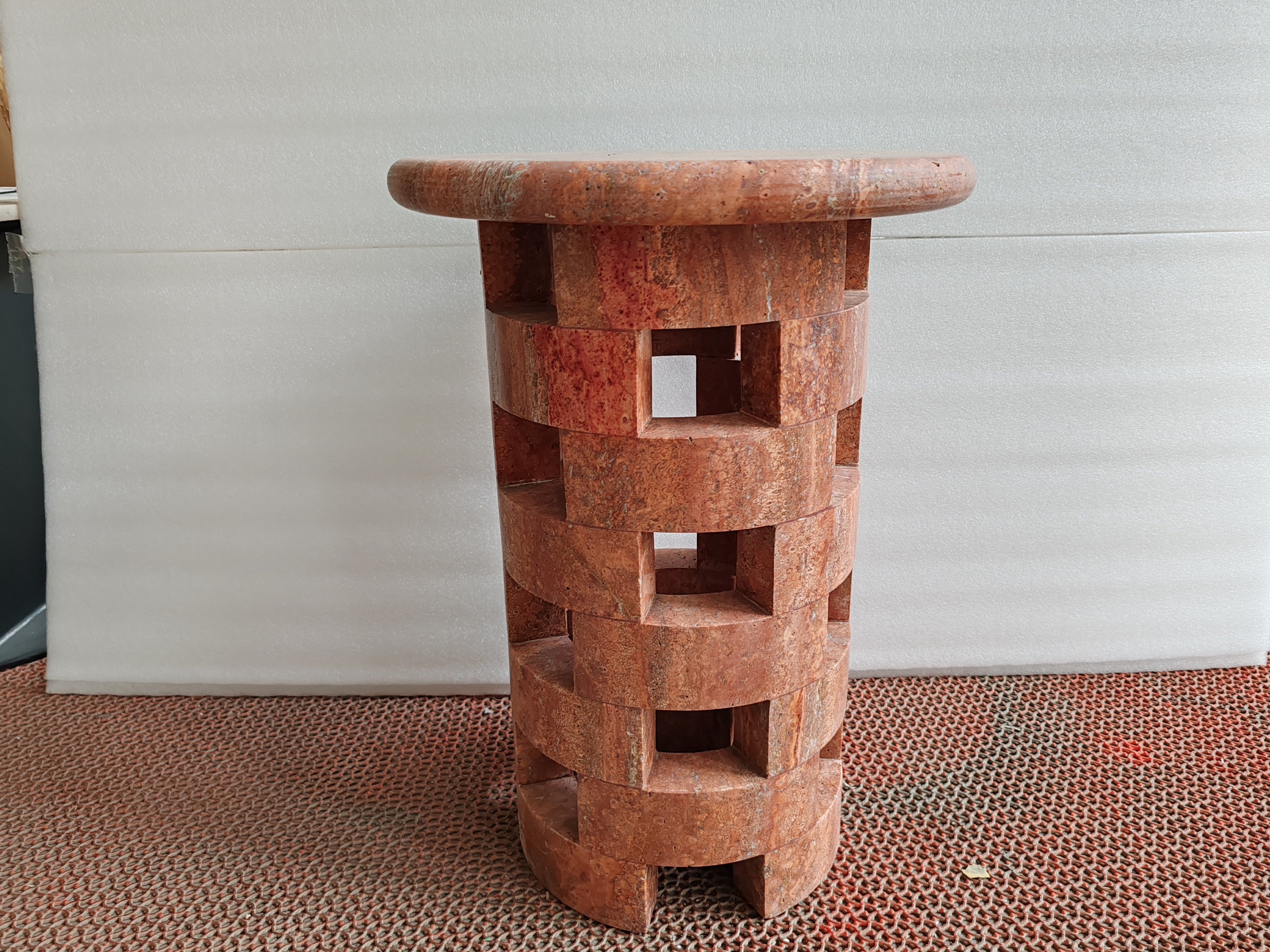 red travertine side table