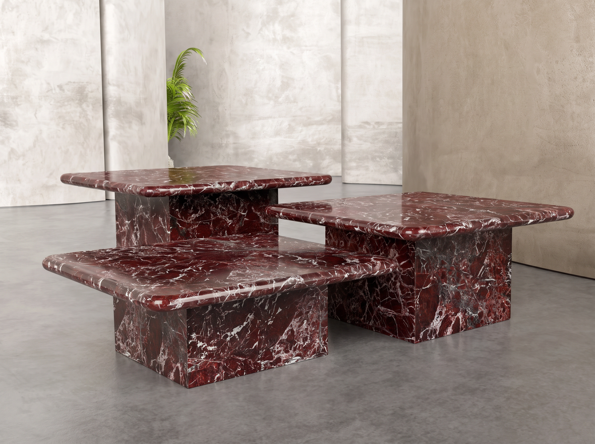 Reda nesting tables in Rosso Levanto marble, angled view